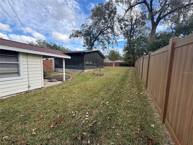 view of yard featuring a sunroom