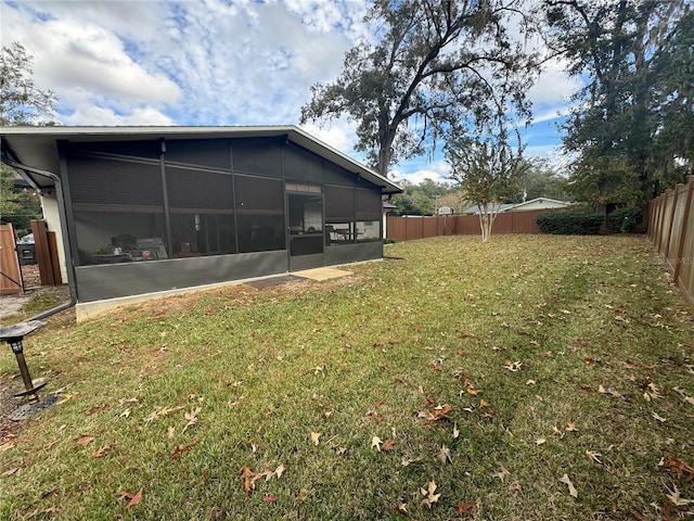 view of yard with a sunroom