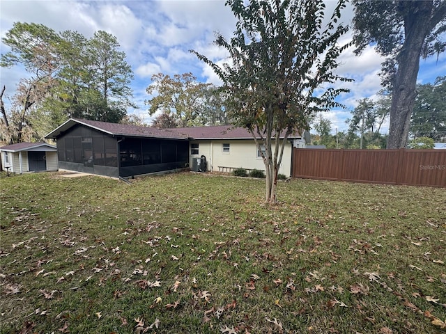 view of yard featuring a sunroom