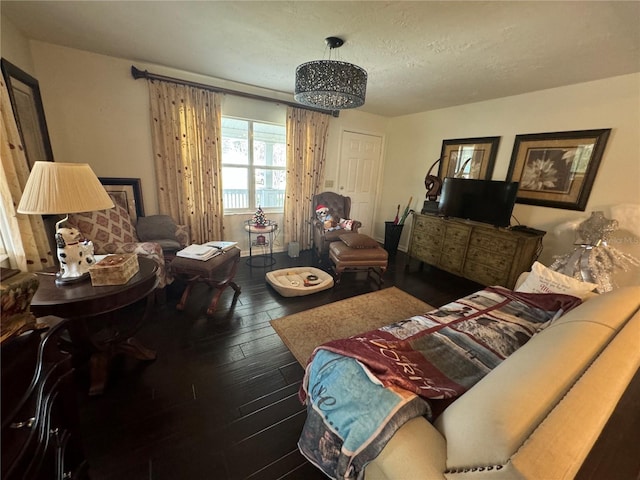 living room featuring a textured ceiling and hardwood / wood-style flooring