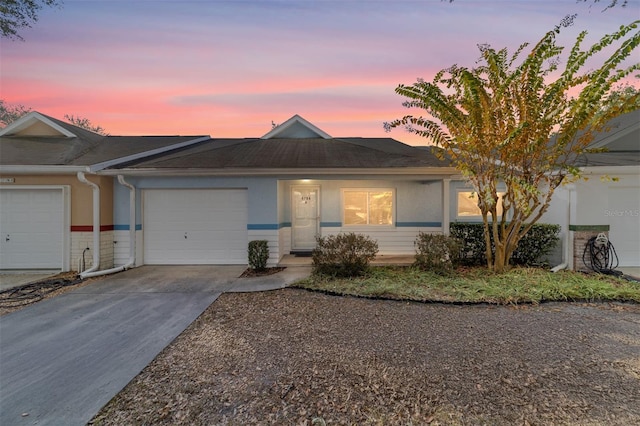 ranch-style home featuring a garage