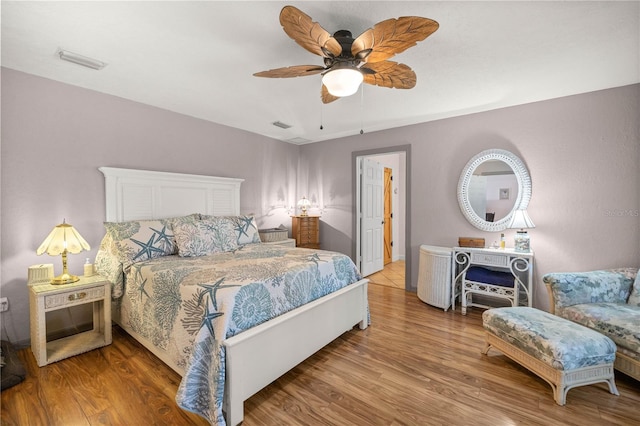 bedroom featuring ceiling fan and wood-type flooring