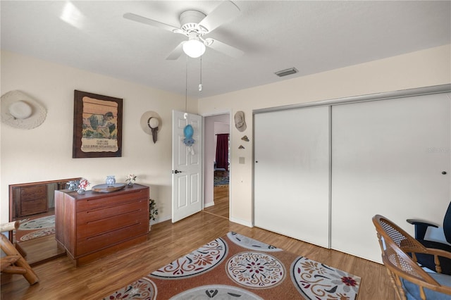 office space featuring hardwood / wood-style flooring and ceiling fan