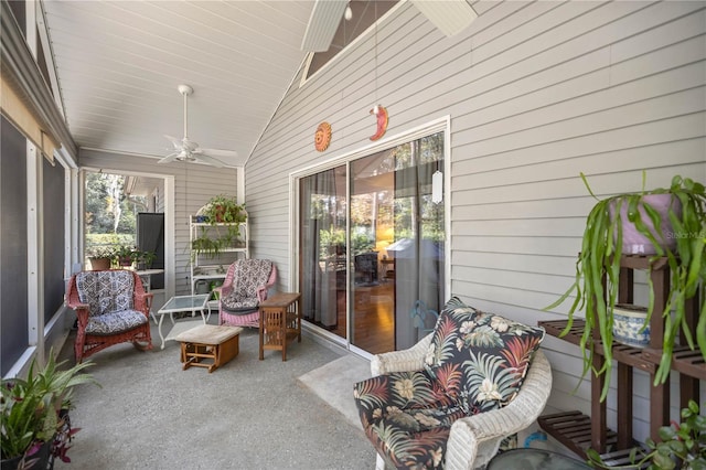 sunroom / solarium with ceiling fan, wood ceiling, and vaulted ceiling