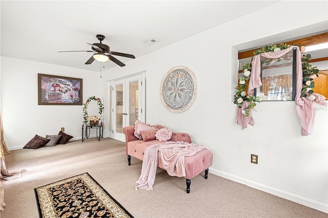 interior space with ceiling fan and french doors