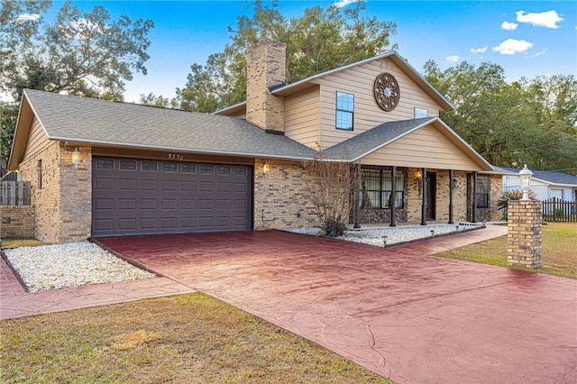 view of front property featuring a front lawn and a garage