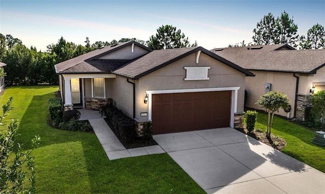 view of front of house with a garage and a front lawn