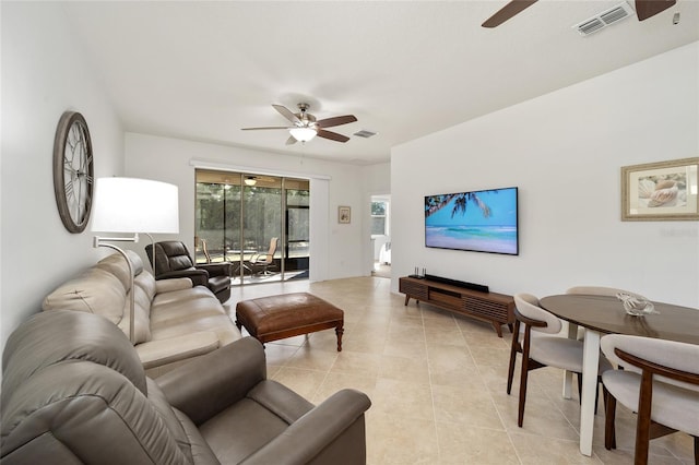 tiled living room featuring ceiling fan