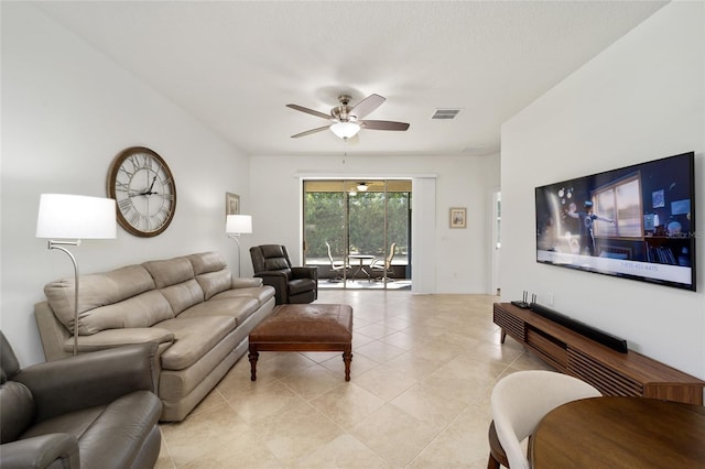 living room featuring ceiling fan and light tile patterned floors