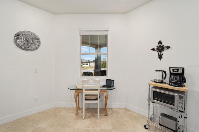 dining space featuring light tile patterned flooring