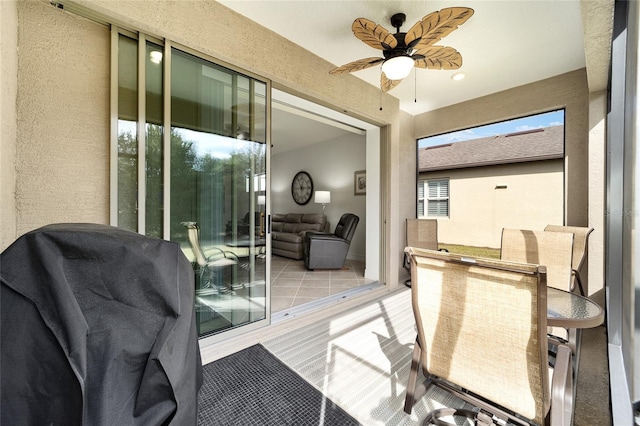 interior space with ceiling fan