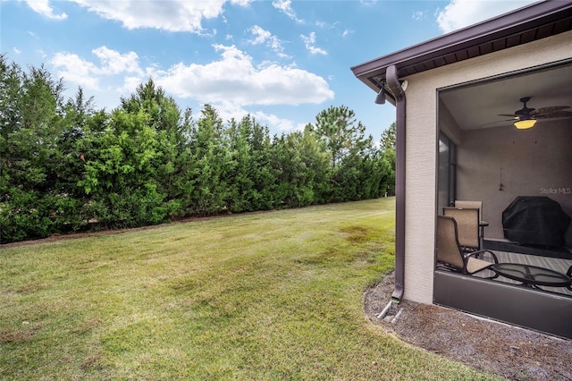 view of yard featuring ceiling fan