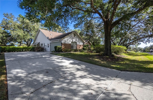 view of property exterior with a yard and a garage