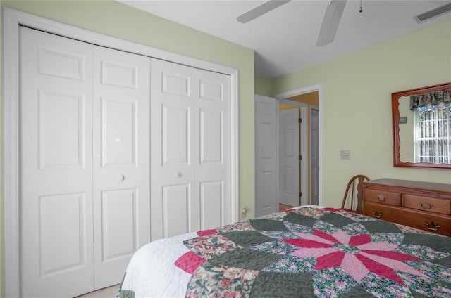 bedroom featuring ceiling fan and a closet