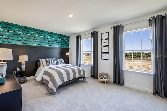 bedroom featuring carpet floors and multiple windows