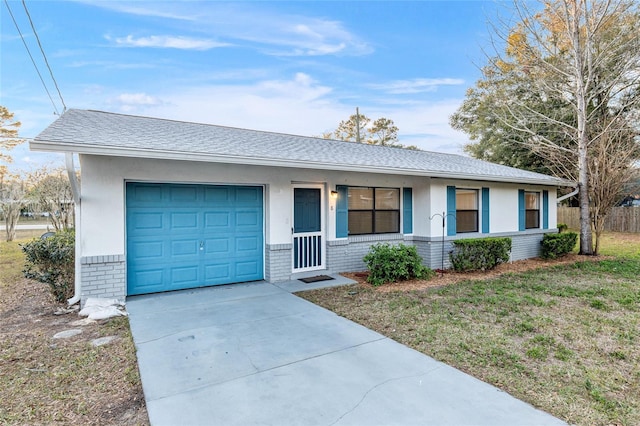 ranch-style house with a garage and a front lawn