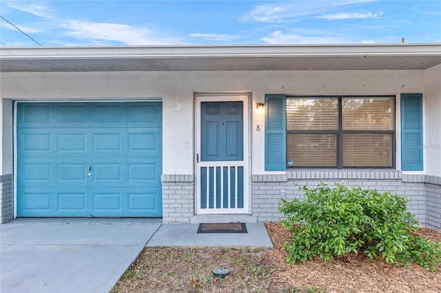 entrance to property featuring a garage