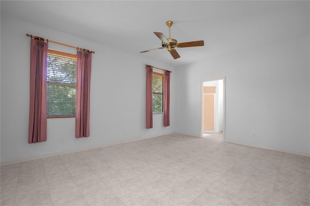 unfurnished room with ceiling fan