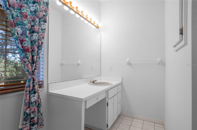 bathroom with tile patterned floors and vanity