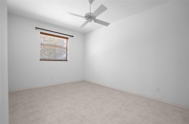 spare room with ceiling fan