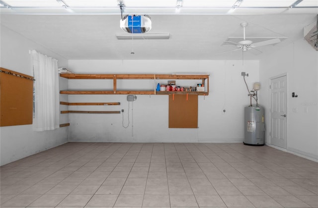 garage featuring water heater, ceiling fan, and a garage door opener