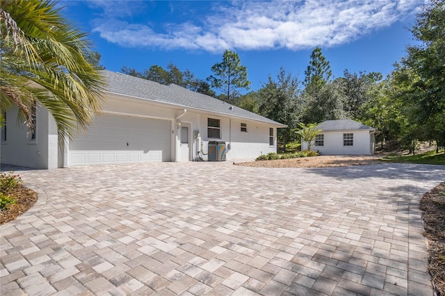 ranch-style home with a garage