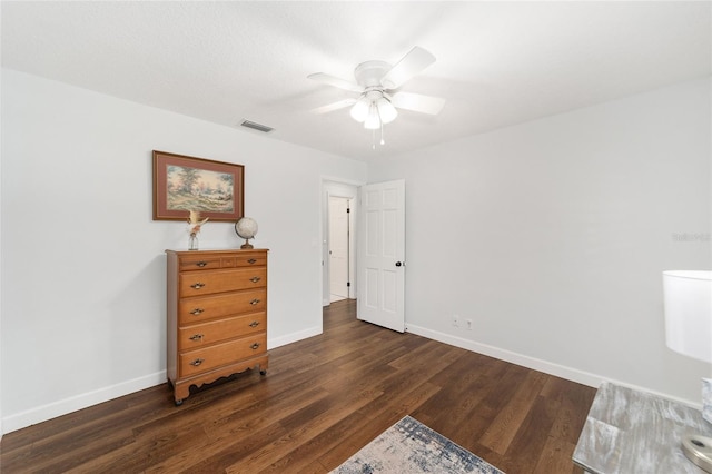 bedroom featuring ceiling fan and dark hardwood / wood-style flooring