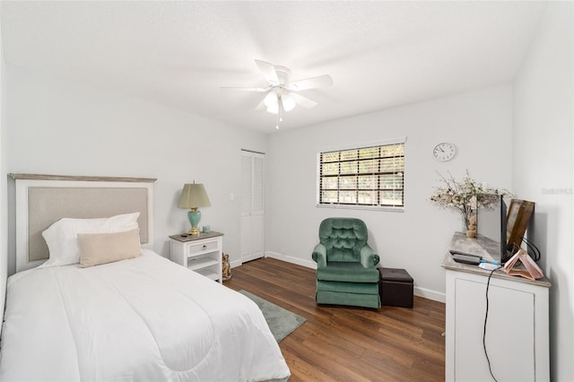 bedroom featuring hardwood / wood-style floors, ceiling fan, and a closet