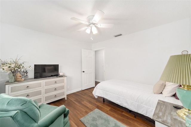 bedroom featuring dark hardwood / wood-style flooring and ceiling fan