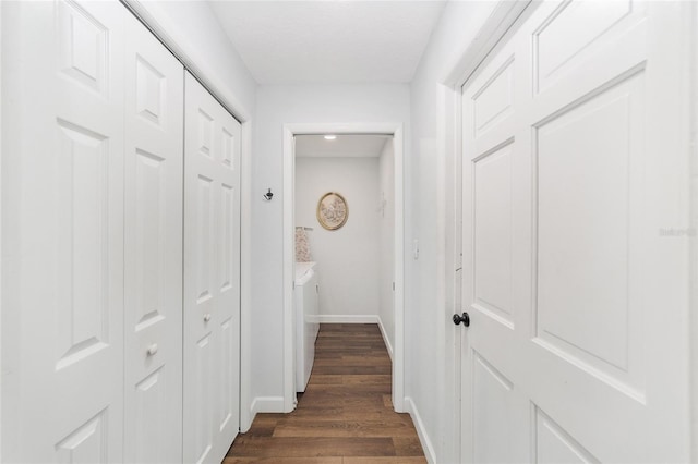 corridor featuring dark hardwood / wood-style floors and washing machine and clothes dryer