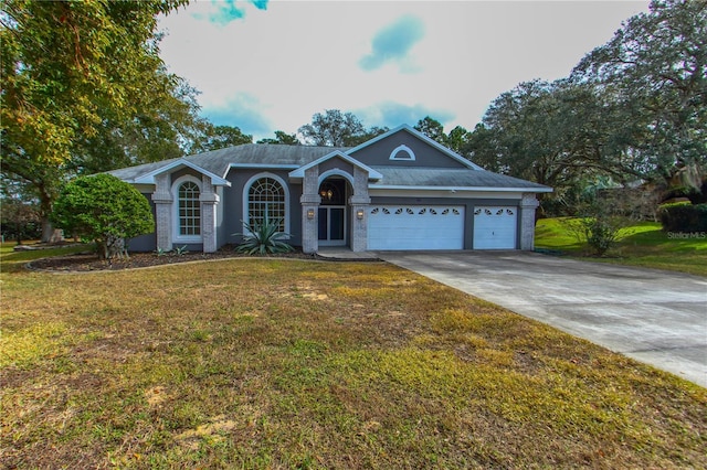 ranch-style house with a garage and a front lawn