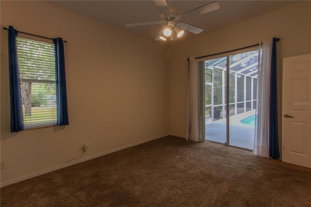 empty room featuring carpet floors, plenty of natural light, and ceiling fan