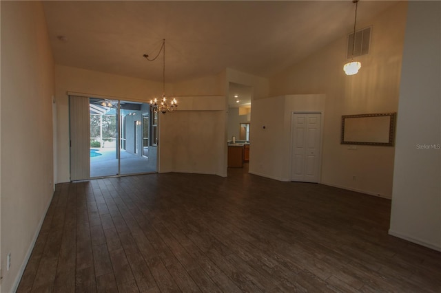 unfurnished room featuring high vaulted ceiling, dark hardwood / wood-style floors, and a notable chandelier