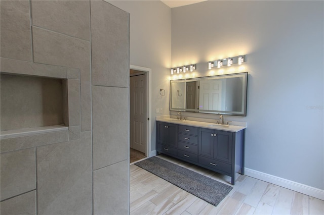 bathroom with vanity and hardwood / wood-style flooring