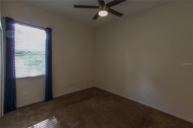 spare room with ceiling fan and carpet floors