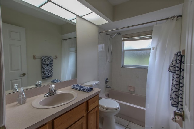 full bathroom featuring tile patterned flooring, vanity, shower / tub combo, and toilet