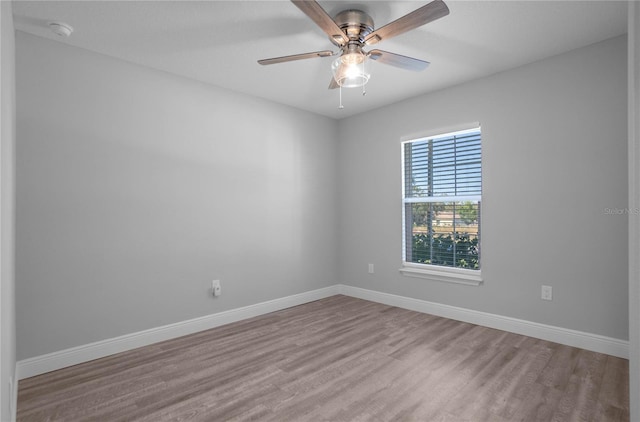 unfurnished room with ceiling fan and light wood-type flooring