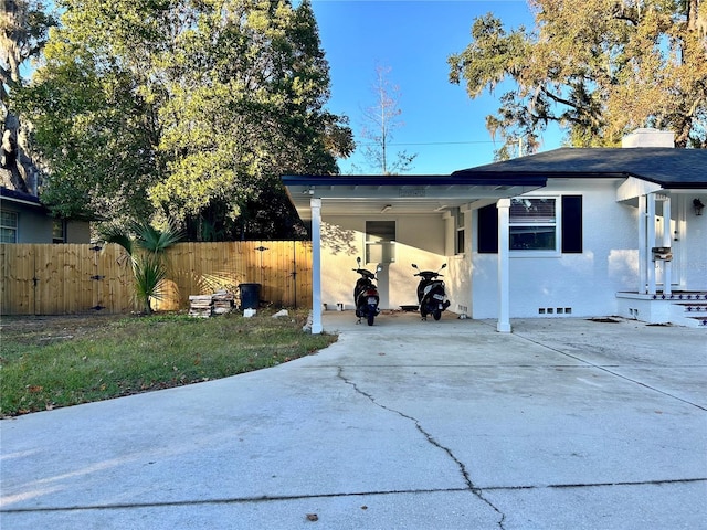 view of property exterior featuring a carport