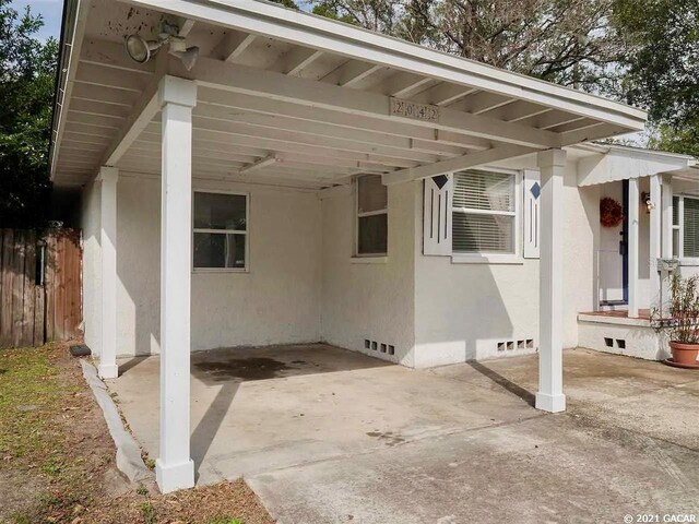 view of patio / terrace with a carport