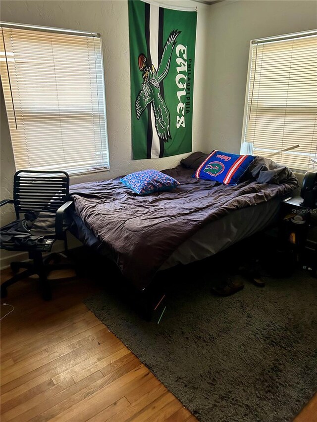 bedroom featuring wood-type flooring