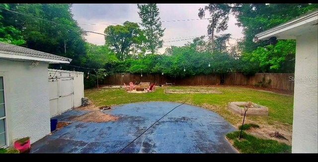 view of yard with a patio area and a shed