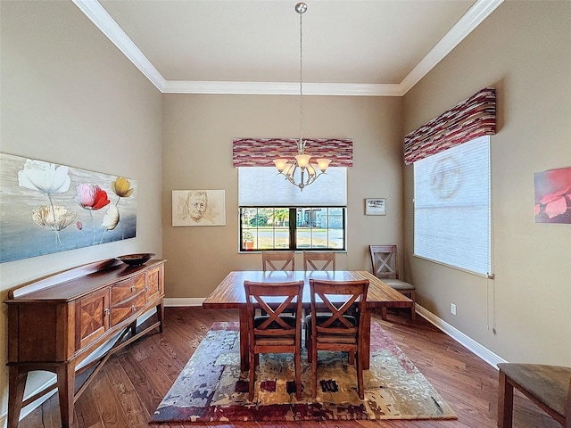 dining area featuring a chandelier, dark hardwood / wood-style floors, and ornamental molding