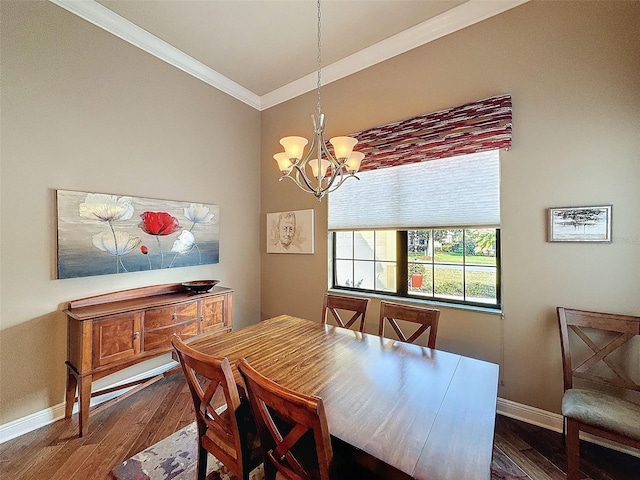 dining area with ornamental molding, dark hardwood / wood-style flooring, and a notable chandelier