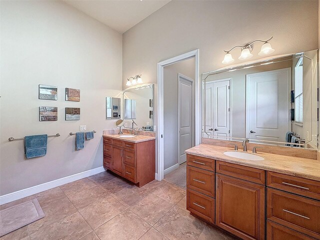 bathroom featuring tile patterned flooring and vanity