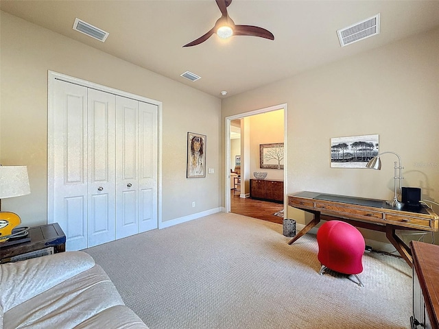 carpeted office with ceiling fan