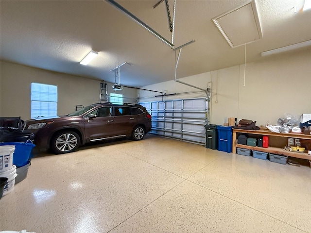 garage featuring a garage door opener