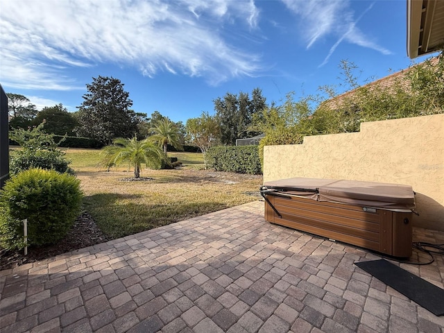 view of patio / terrace featuring a hot tub