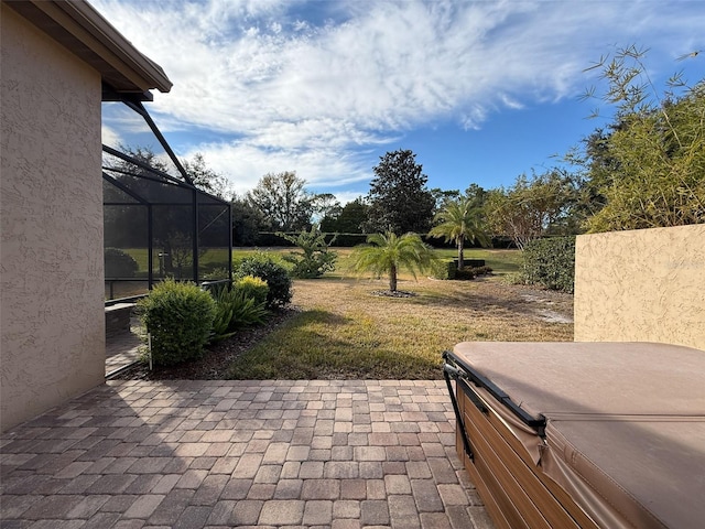 view of patio / terrace featuring a lanai