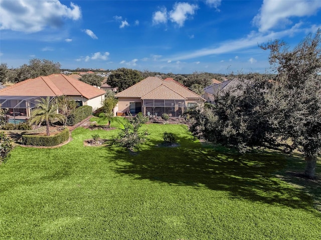 view of yard with a lanai