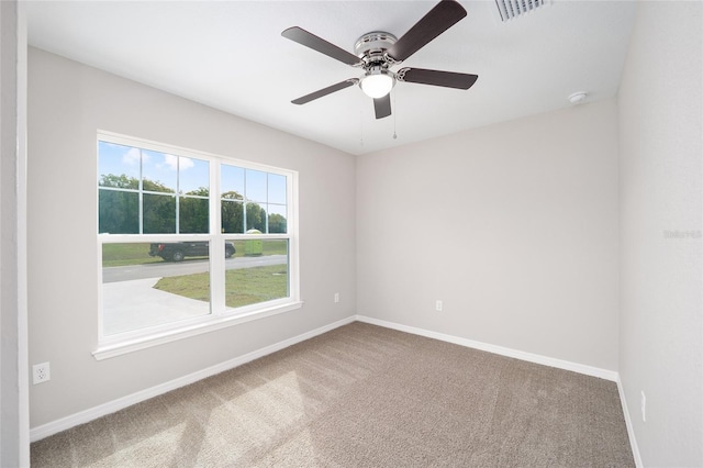 empty room featuring ceiling fan and carpet flooring